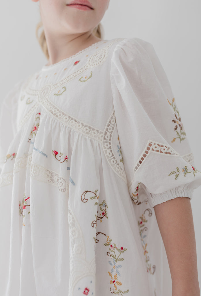 PETITE AMALIE "La Fleur" Petite Amalie Cross Stitch Elbow Sleeve White Dress